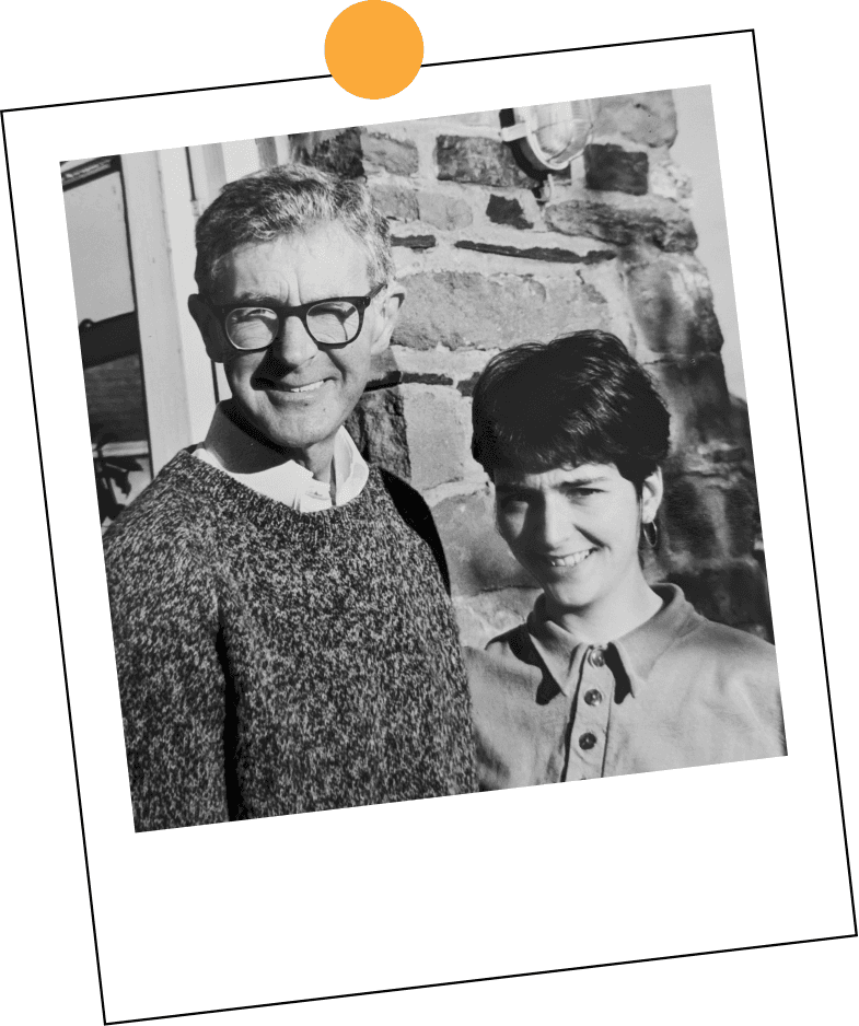 Miranda's father with her as a girl, outside the house